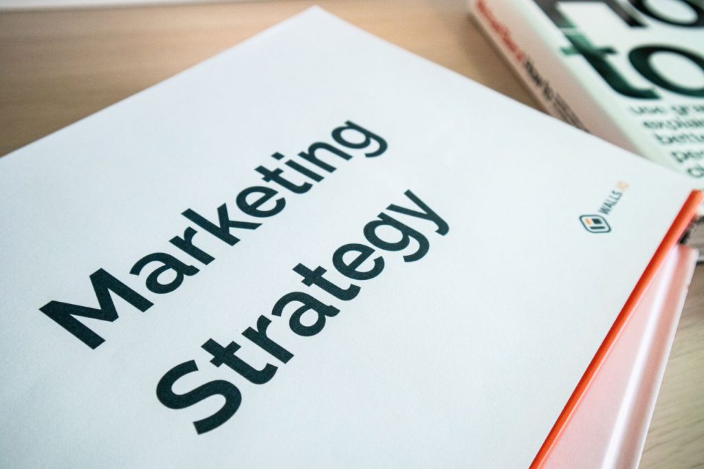 Top 10 SEO Strategies to Rank Higher on Google Close-up of a marketing strategy document on a desk, ideal for business content.