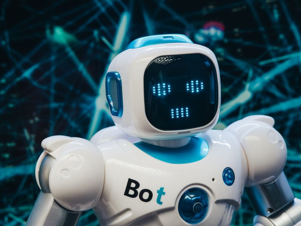 AI Used by Humans:1 How Artificial Intelligence Is Changing Everyday Life Close-up of a futuristic humanoid robot with a digital face display, representing modern technology.